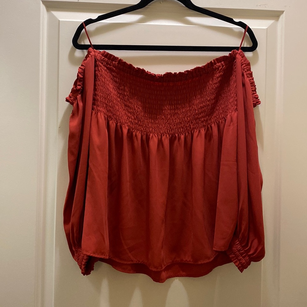 Beautiful coral color blouse. Perfect for the summer.